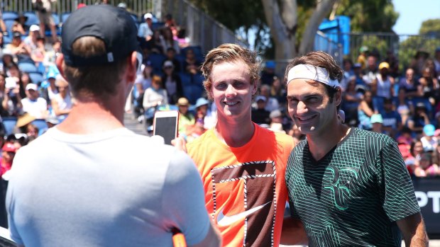 Photo-op: Roger Federer poses for a picture with Blake Ellis on Wednesday.
