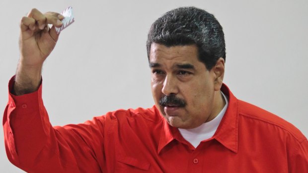 Venezuela's President Nicolas Maduro casts his vote in the constitutional assembly elections.