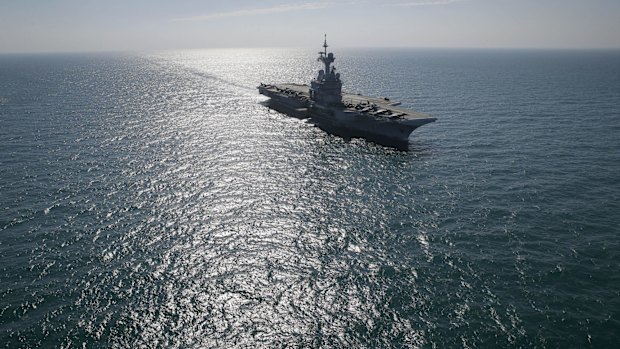 France's flagship Charles de Gaulle aircraft carrier navigates in the Persain Gulf as part of the US- led coalition against the Islamic State group, conducting airstrikes in Syria earlier this month.