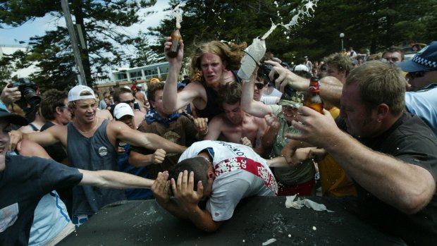 Racial tensions: A man is surrounded and beaten by a drunken mob during the Cronulla riots.