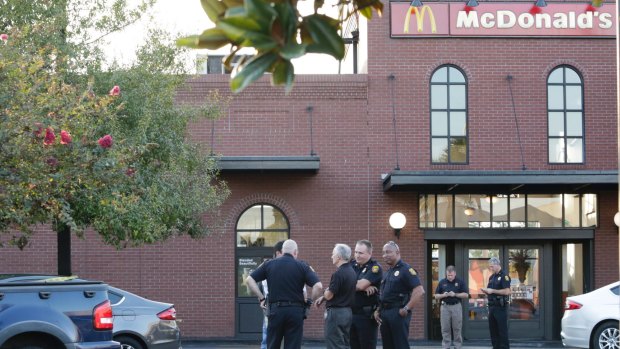 Police arrested the suspect after receiving a tip off about a man with a gun in a McDonald's restaurant. 