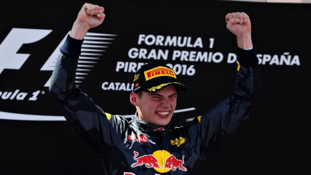 Max Verstappen of Netherlands celebrates his first win on the podium during the Spanish Formula One Grand Prix.