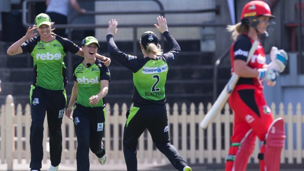 Sophie Molineux leaves the field after being caught by Thunder's Naomi Stalenberg on Saturday during the Women's Big Bash League season-opening weekend of matches.