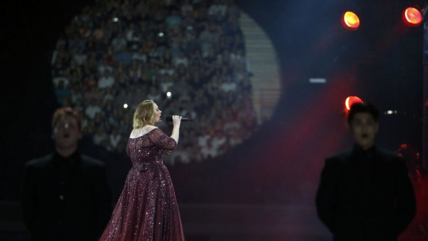 Adele struggled with Brisbane's extended summer, telling fans, "even my eyelids are sweating".