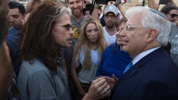 David Friedman, right, speaks with Aerosmith frontman Steven Tyler during his Monday visit to the Western Wall.