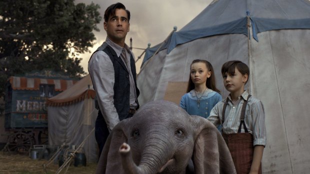 Colin Farrell (left), Nico Parker and Finley Hobbins in a scene from Dumbo.