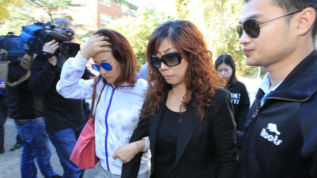 Family members of Michelle Leng, including her mother (in black) arrive at Burwood Local Court on Wednesday. 