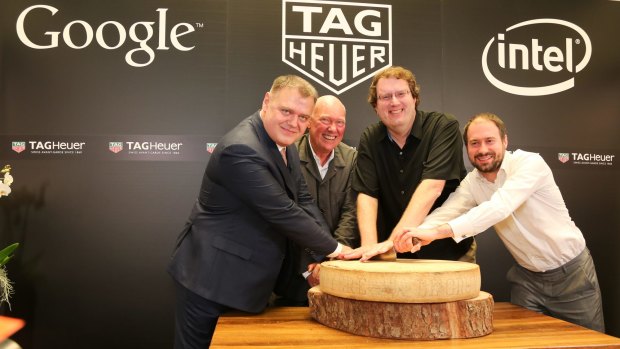 Tag Heuer's Guy Semon, LVMH president of watches Jean-Claude Biver, Google's David Singleton and Intel's Michael Bell announced their companies' partnership at Baselworld, then cut a huge wheel of Bivel's famously exclusive cheese.