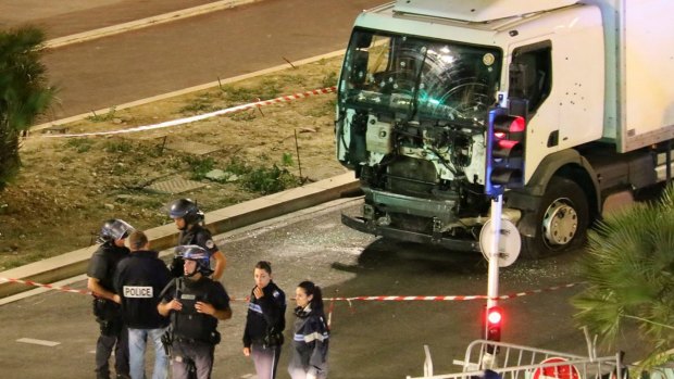 Police investigate the truck that ploughed down the Promenade des Anglais.