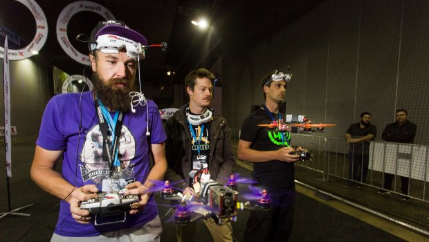Serious stuff: Drone racing competitors (left to right) Jamie Frederick, Michael Webb and Justin Power on Sunday at the DroneX national tournament held at Sexpo at Melbourne Convention and Exhibition Centre.