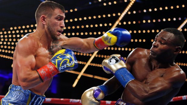 Vasyl Lomachenko punches Guillermo Rigondeaux during the third round of their bout in New York.