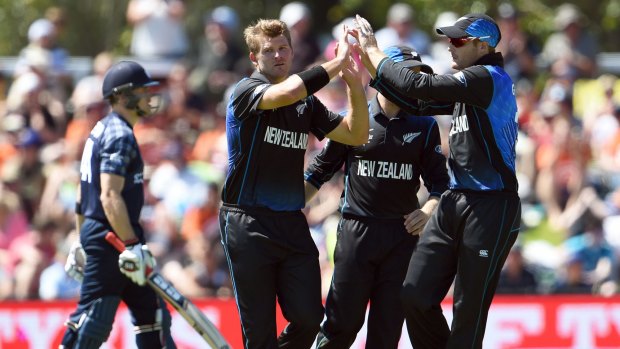 New Zealand's Corey Anderson (left) celebrates a wicket.
