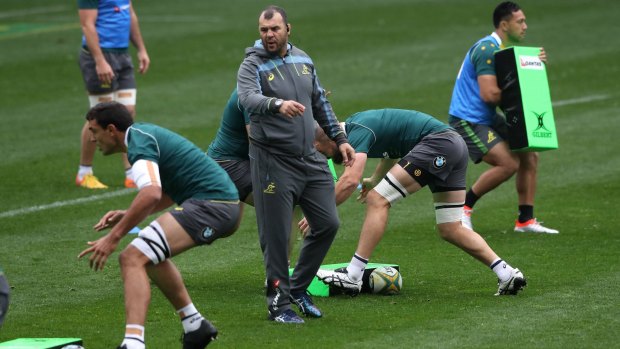Unconcerned: Michael Cheika issues instructions to his team during an Australian Wallabies captain's run at AAMI Park on Friday. 