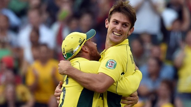 Mitchell Marsh (right) celebrates with teammate Aaron Finch after dismissing England's Gary Ballance.