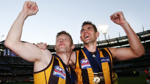 Starsky and Hutch: Sam Mitchell and Luke Hodge celebrate one of their four premierships.