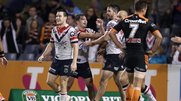 Too easy: Roosters player celebrate after Connor Watson's try.