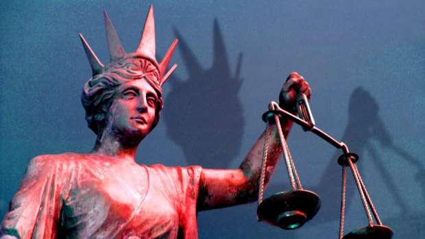 A man accused of hiding with a gun in his ex-girlfriend's Canberra home after their relationship soured was brought before the ACT Supreme Court for a retrial on Monday.