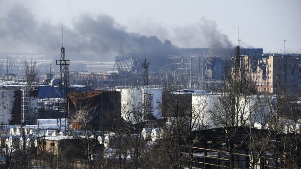 Smoke rises over the new terminal of Donetsk airport in eastern Ukraine.