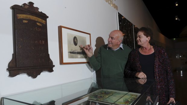 Kevin and Sue McIntosh, relatives of Arnold Arthur McIntosh, admire some of the artefacts they handed over to the gallery on Thursday.