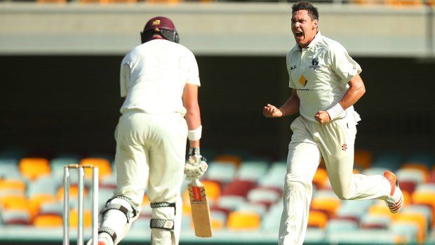 Out-paced:  Scott Boland celebrates after dismissing Queensland's Matthew Renshaw.