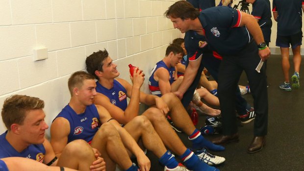 Good show: Bulldogs coach Luke Beveridge has a word with Tom Boyd in the rooms after the game.