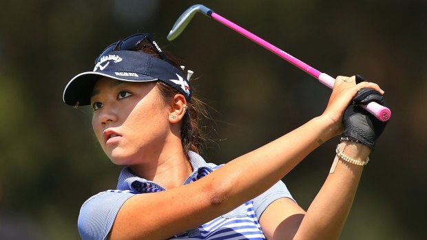 In the hunt: Lydia Ko hits an approach shot on the first hole of the Australian Open at Royal Melbourne.