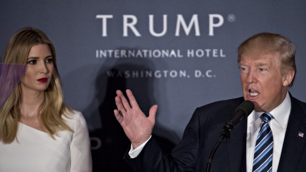 Donald Trump with his daughter Ivanka during the opening ceremony for the Trump International Hotel in Washington, DC.