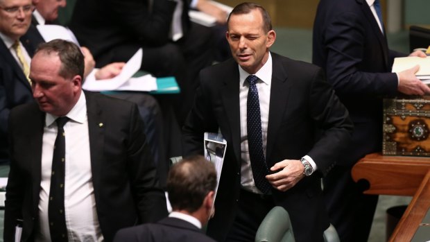 A wink from Prime Minister Tony Abbott in the direction of Environment Minister Greg Hunt at Parliament House.