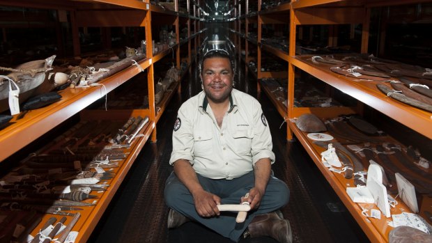 Adrian Brown with clapping sticks he has made which will be appear in the "Encounters" exhibition at the National Museum of Australia.