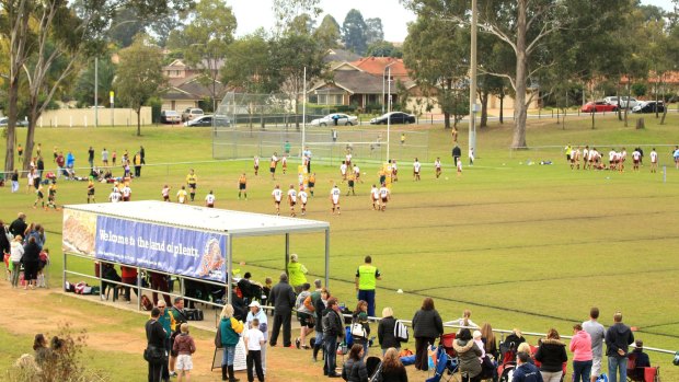 Parents and fans watch youngsters playing at Chad Towns Reserve, Glenmore Park last month.