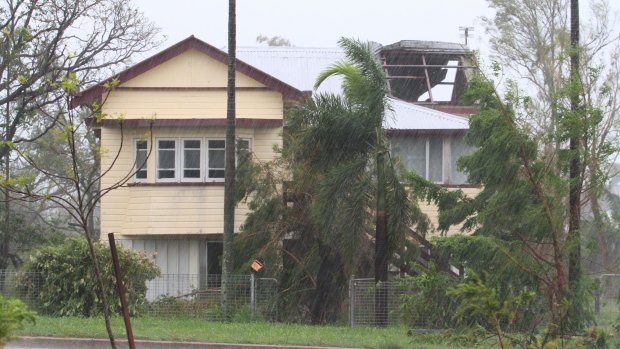 A Bowen house is missing half its roof in the aftermath of the cyclone.