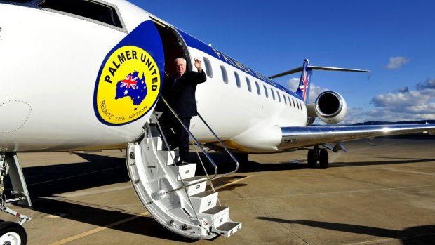 Clive Palmer boards his private jet on the campaign trail. Palmer Aviation took out a loan in 2012 to buy the Bombardier aircraft.