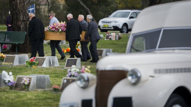 The funeral procession arrives at Queanbeyan Lawn Cemetery led by the restored pie truck that Leicester Donoghoe used to drive. 