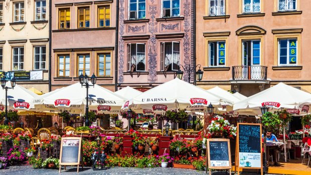 Outdoor bars and restaurants in Stary Rynek, Old Town Market Place in Warsaw, Poland.