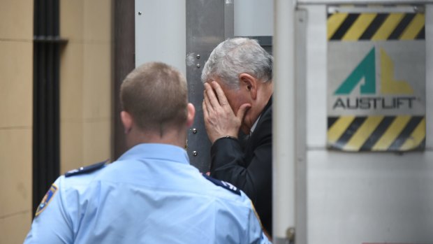 Haydar Haydar hides his face as he arrives at the Supreme Court on Friday.