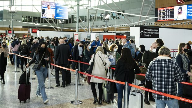 Qantas passengers queue for security checks at Sydney Airport's Terminal 3 last month.