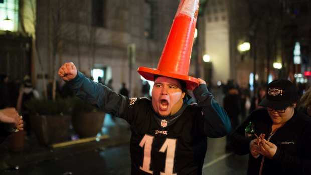 Madness: A Philadelphia Eagles fan marches with a cone on his head. This was very much the tame part of the celebrations.