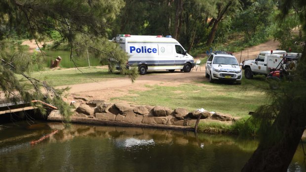Police search a water hole in the Bents Basin Conservation Area after a 25-year-old went missing. 