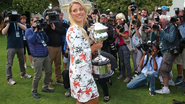 The day after the night before: Australian Open champion Angelique Kerber  holds the Daphne Akhurst Memorial Cup at Government House on Sunday.