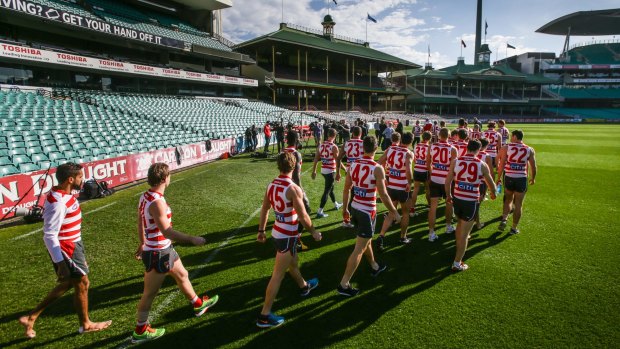 Swans players walk out onto the SCG to show solidarity for Adam Goodes at the club press conference on Thursday.