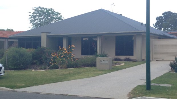 Another example of a new home in Perth with a black roof and little shade. 