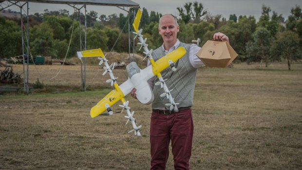 Project Wing has been developing a drone delivery service for Tuggeranong, delivering hot meals and chemist supplies. Delivery project manager Luke Barrington takes delivery of a hot lunch from Guzman Y Gomez.
