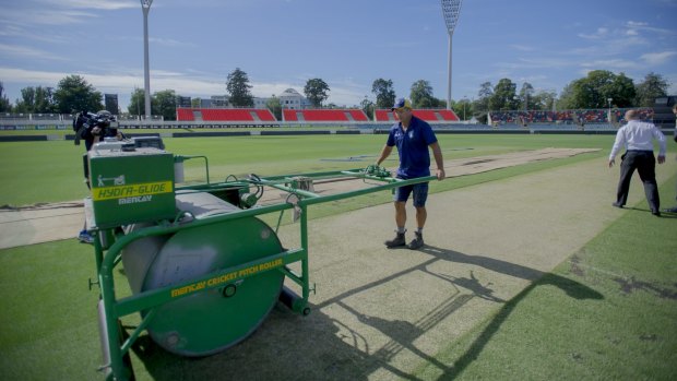 The Manuka Oval pitch gets its final touches before Wednesday's one day international match by curator Brad Van Dam.