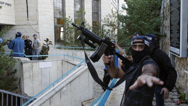 An Israeli police officer near the scene of the attack on the synagogue.