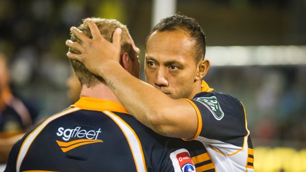 Brumbies skipper Christian Lealiifano consoles David Pocock after losing to the Waratahs on Saturday. 