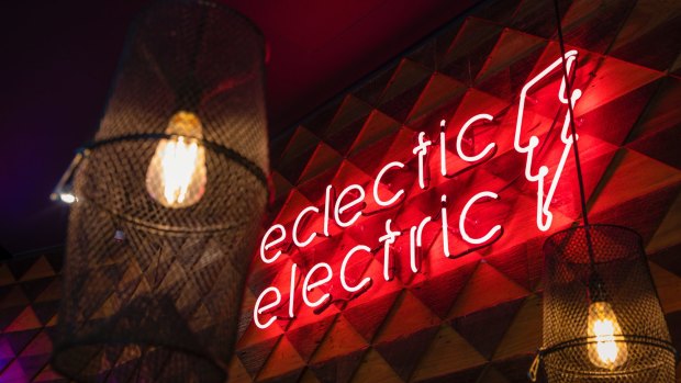 Flashing red neon makes it impossible to miss the hyper-hip eatery.