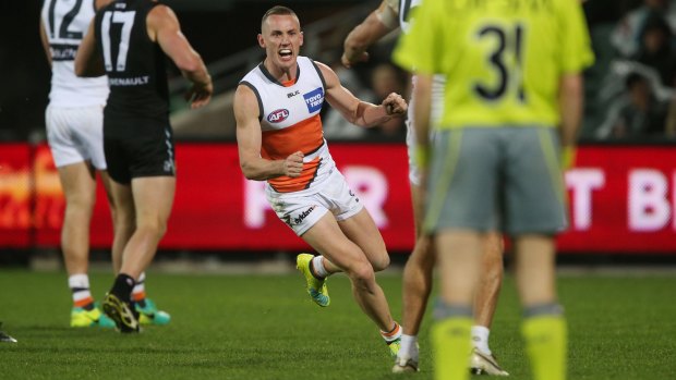 Silencing their critics: Tom Scully celebrates a goal against Port Adelaide Power at the Adelaide Oval in July.