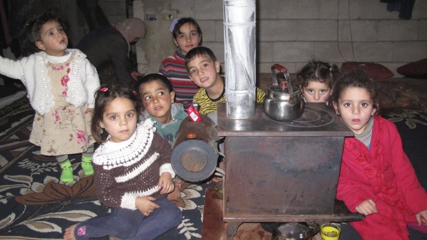 Uncertain future: Some of the 11 Syrian refugee children who live in the small room.