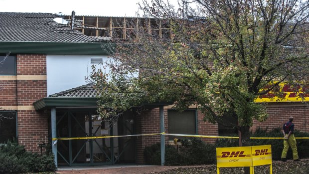 Emergency services assess the DHL roof collapse on Canberra Avenue in Fyshwick.