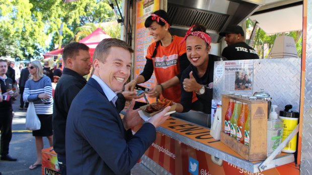 Brisbane councillor Julian Simmonds tries out the King of the Wings.